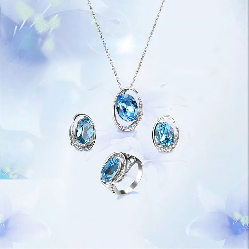 Luxurious Three-Piece Jewelry Set with Oval-Cut Blue Gemstone