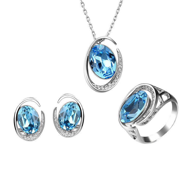 Luxurious Three-Piece Jewelry Set with Oval-Cut Blue Gemstone