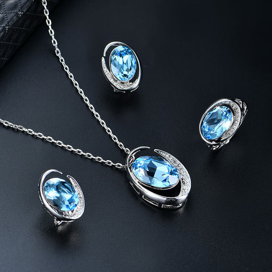 Luxurious Three-Piece Jewelry Set with Oval-Cut Blue Gemstone