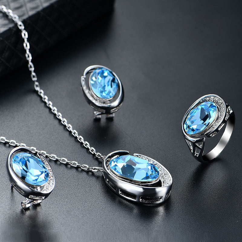 Luxurious Three-Piece Jewelry Set with Oval-Cut Blue Gemstone