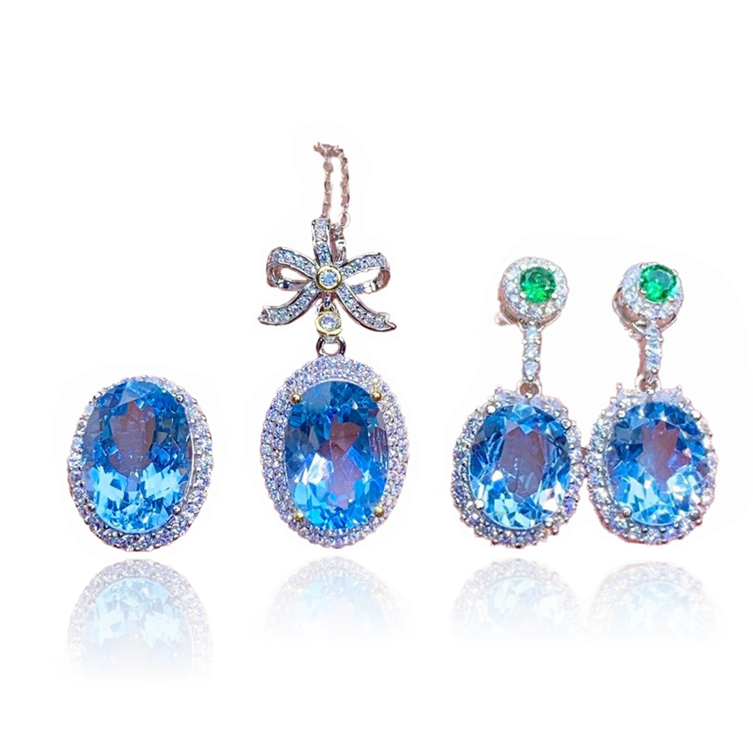 Boucles d'oreilles pendantes en topaze et bague en cristal